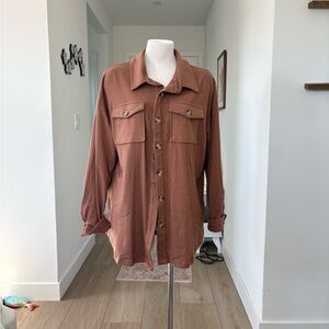 Brown cotton button-up shirt with a relaxed fit